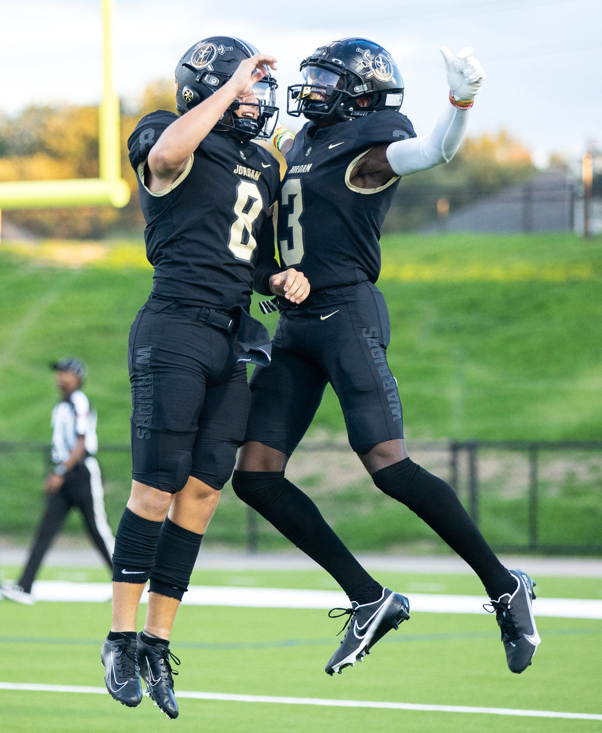 Jordan quarterback Colin Willetts and wide receiver Andrew Marsh celebrate after scoring a touchdown during Saturday’s game between Jordan and Aldine Davis.